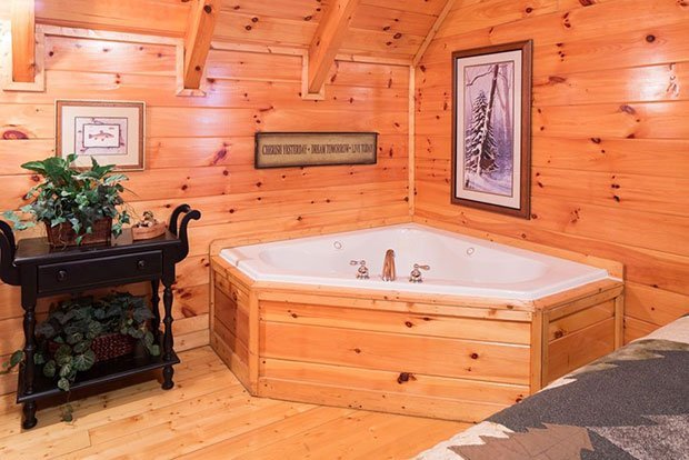 Log cabin bedroom jacuzzi