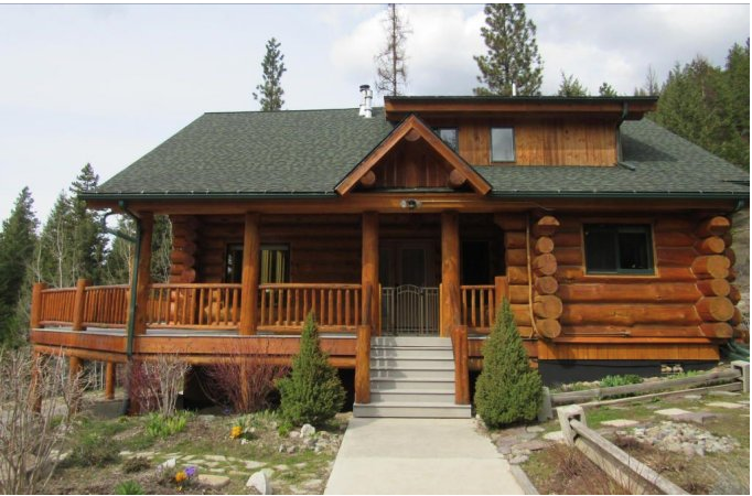 Montana Log Cabin With Wraparound Porch For Sale