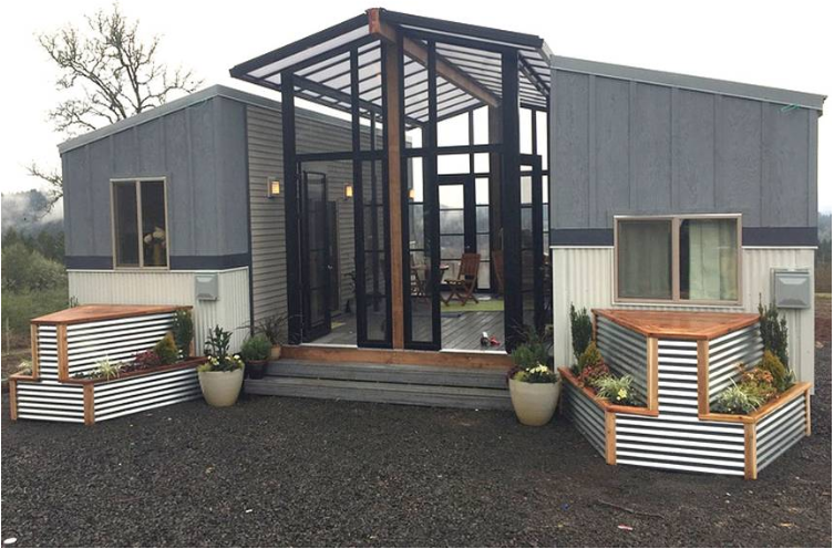 Two Tiny Houses Connected With A Central Sun Room & Deck